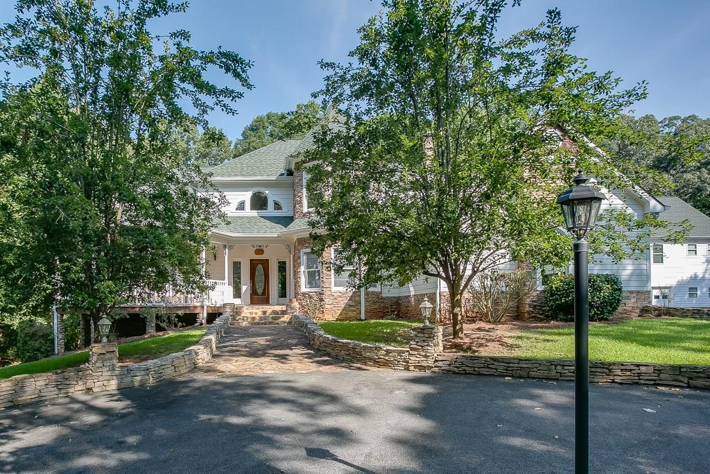 6574 McEver Road Flowery Branch, GA 30542 - Photo 1 of 1 Exceptional, Flowery Branch estate with 2 story Victorian 4 bedroom/4 bath home and separate 2 bedroom/2 bath guest home (both are 3 level homes)