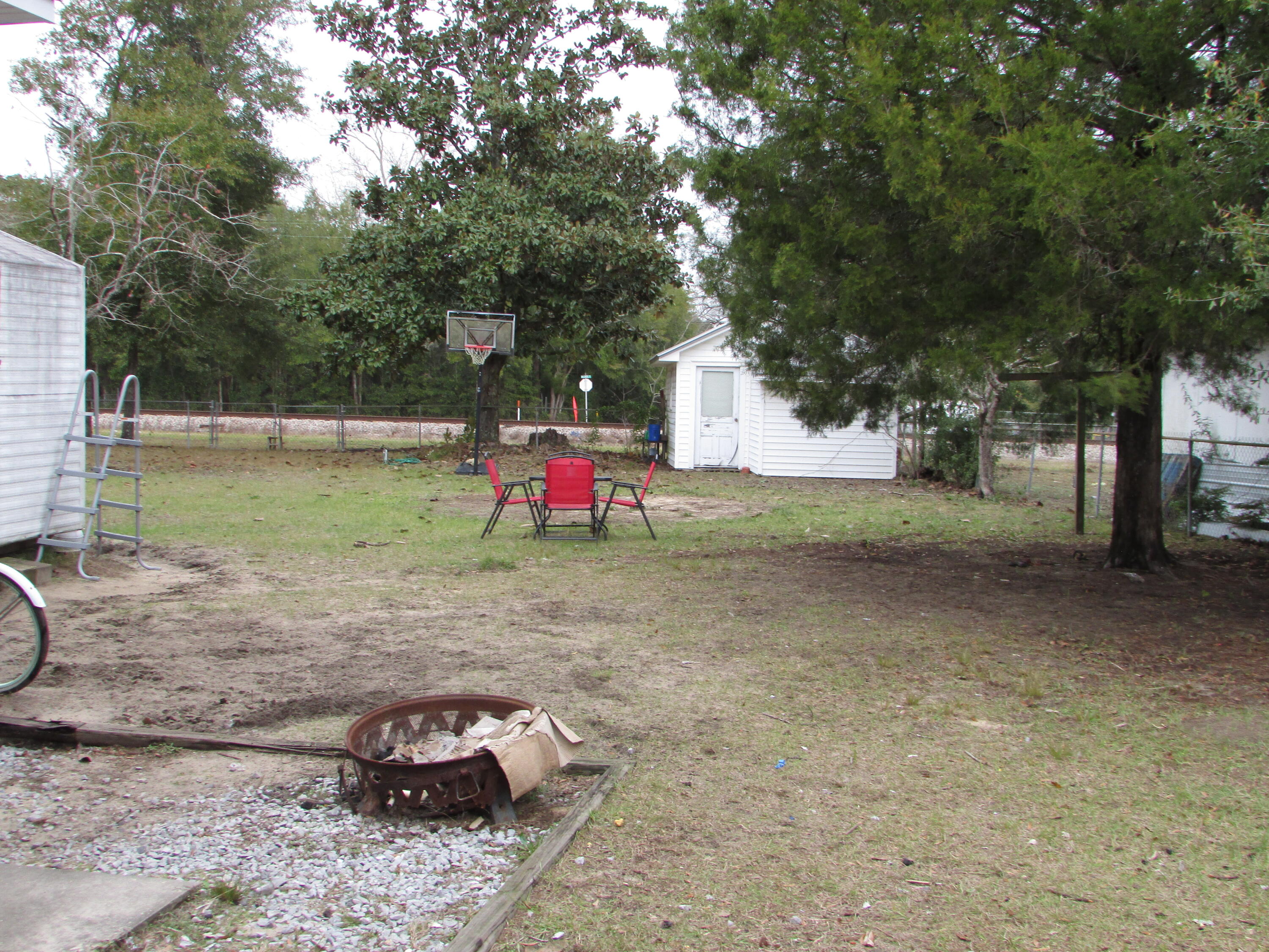 64 Live Oak Avenue West DeFuniak Springs, FL 32435 - Photo 14 of 20 a view of a yard with a tree