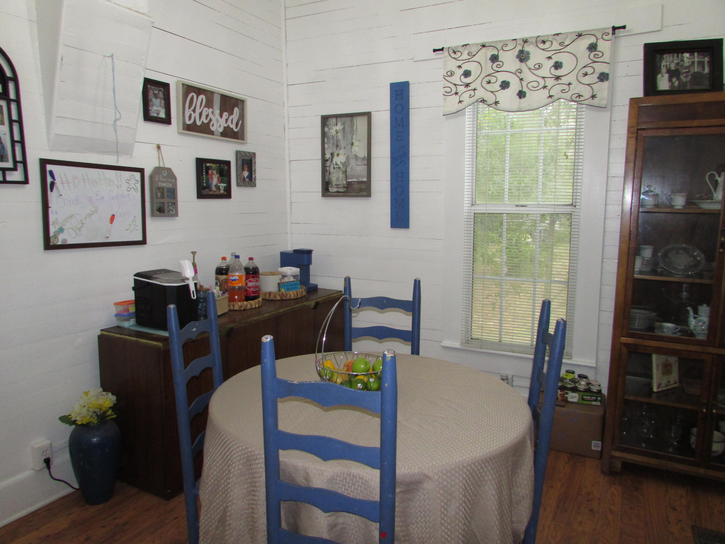 64 Live Oak Avenue West DeFuniak Springs, FL 32435 - Photo 3 of 20 a view of a dining room with furniture and window