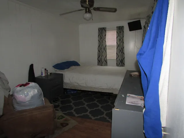 a bedroom with furniture and a window