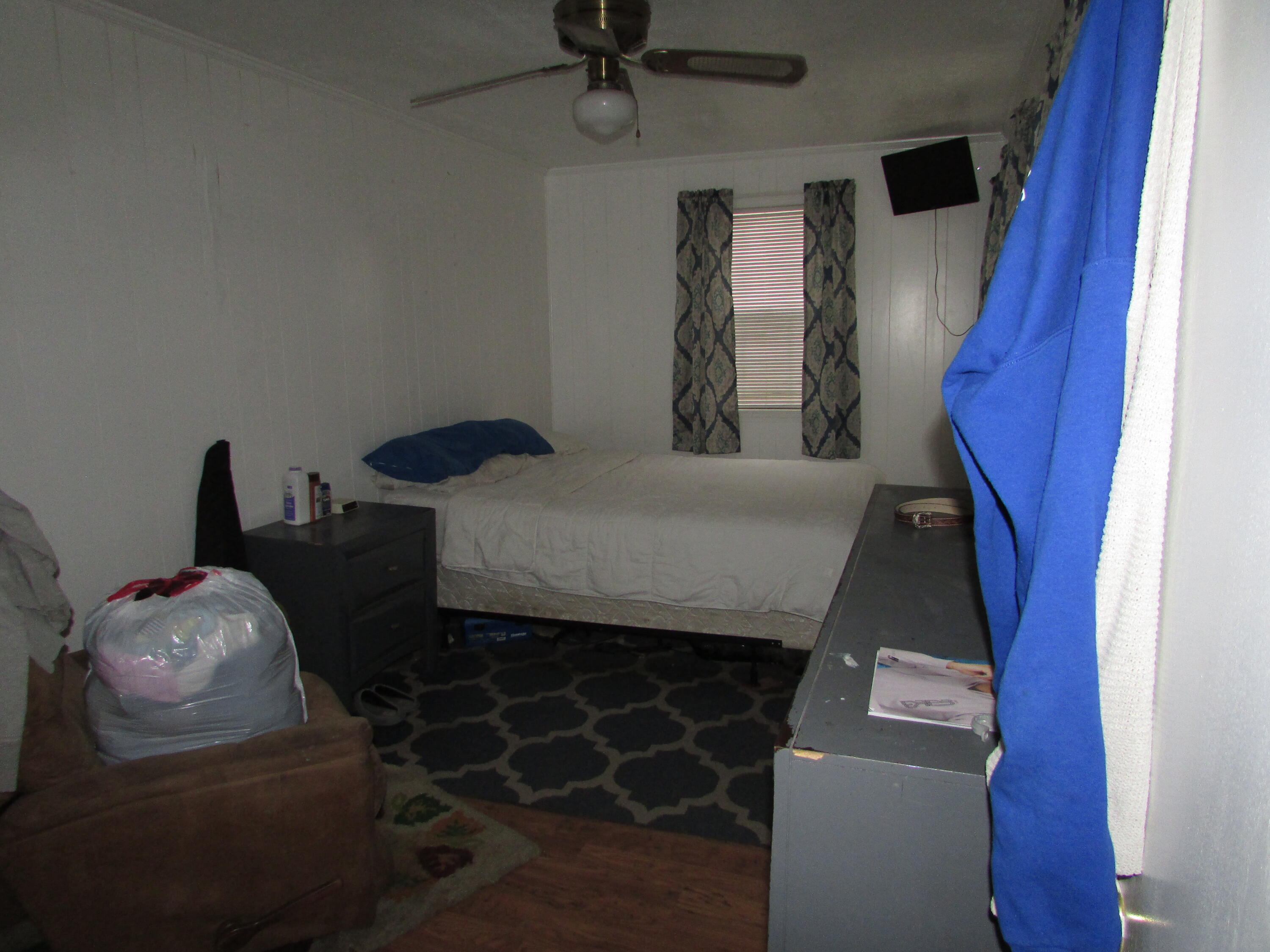 64 Live Oak Avenue West DeFuniak Springs, FL 32435 - Photo 9 of 20 a bedroom with furniture and a window