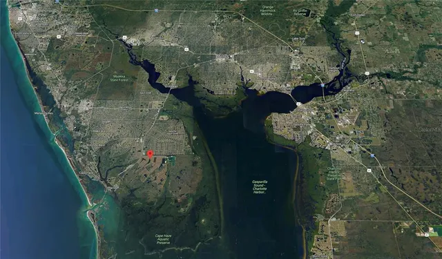 an aerial view of a houses with yard