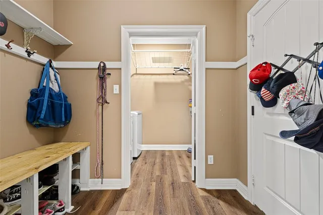 a view of a room with wooden floor and closet