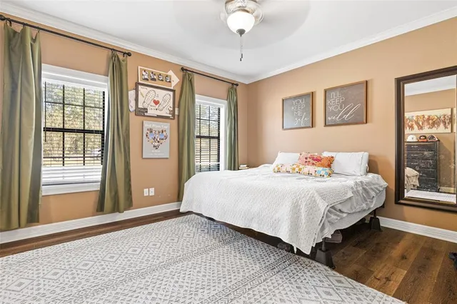 a bedroom with a large bed and a window
