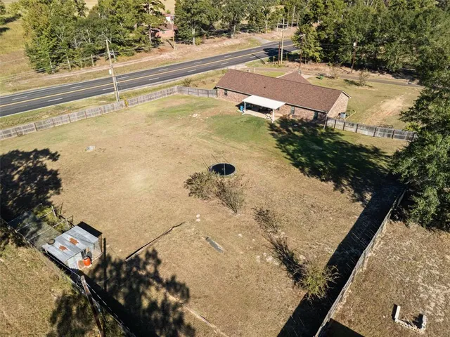 a view of a swimming pool with a yard