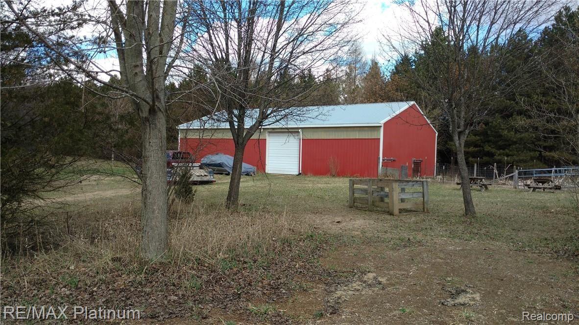 4692 Vines Road Howell, MI 48843 - Photo 9 of 32 44 x 66 barn. Cement floor, animal pens.