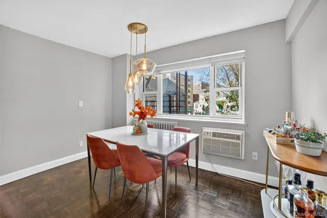a view of a dining room with furniture window and outside view