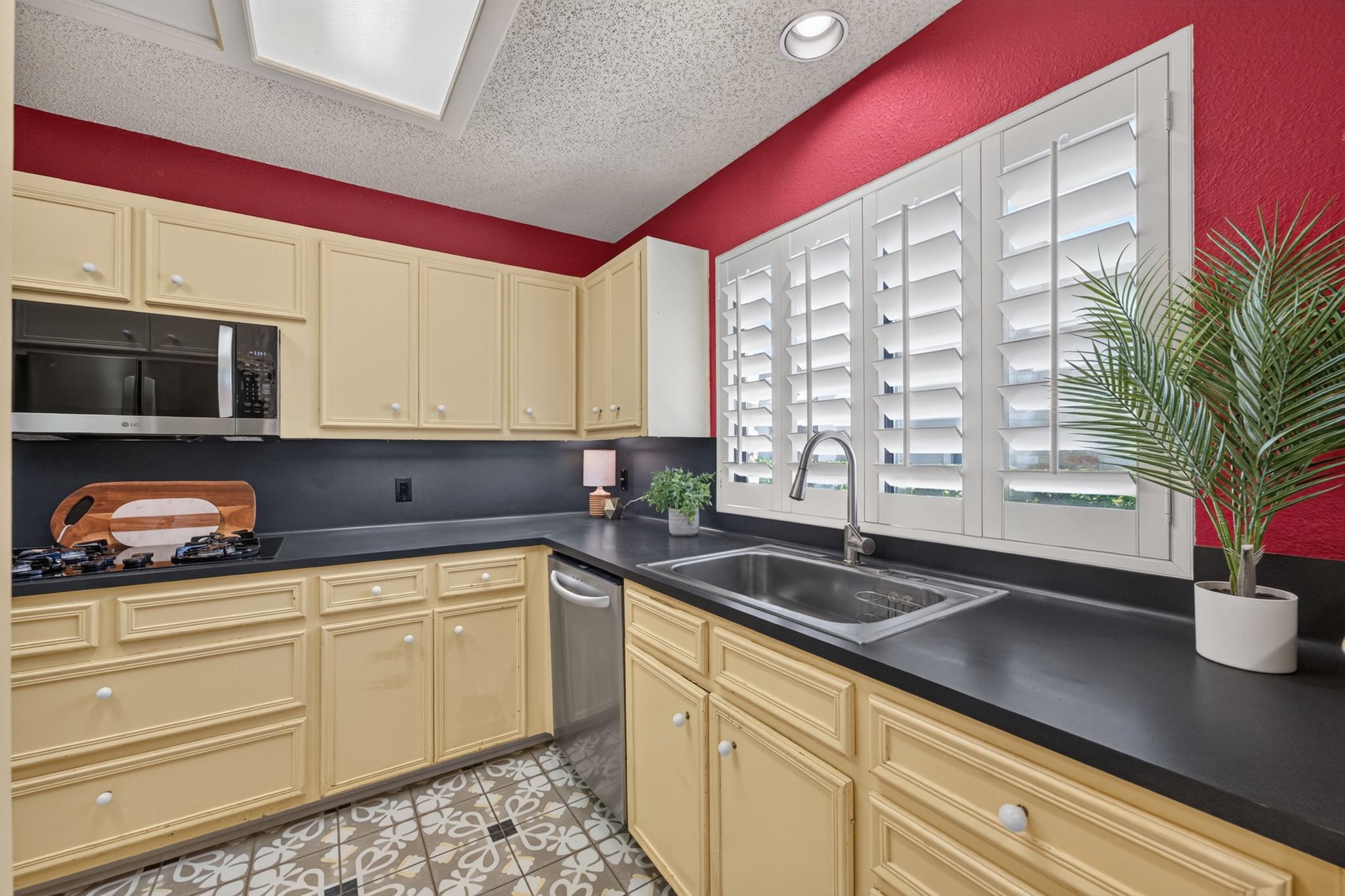 1907 Stoneridge Road Austin, TX 78746 - Photo 11 of 36 Well-appointed kitchen with ample cabinetry, counter space, and natural light.
