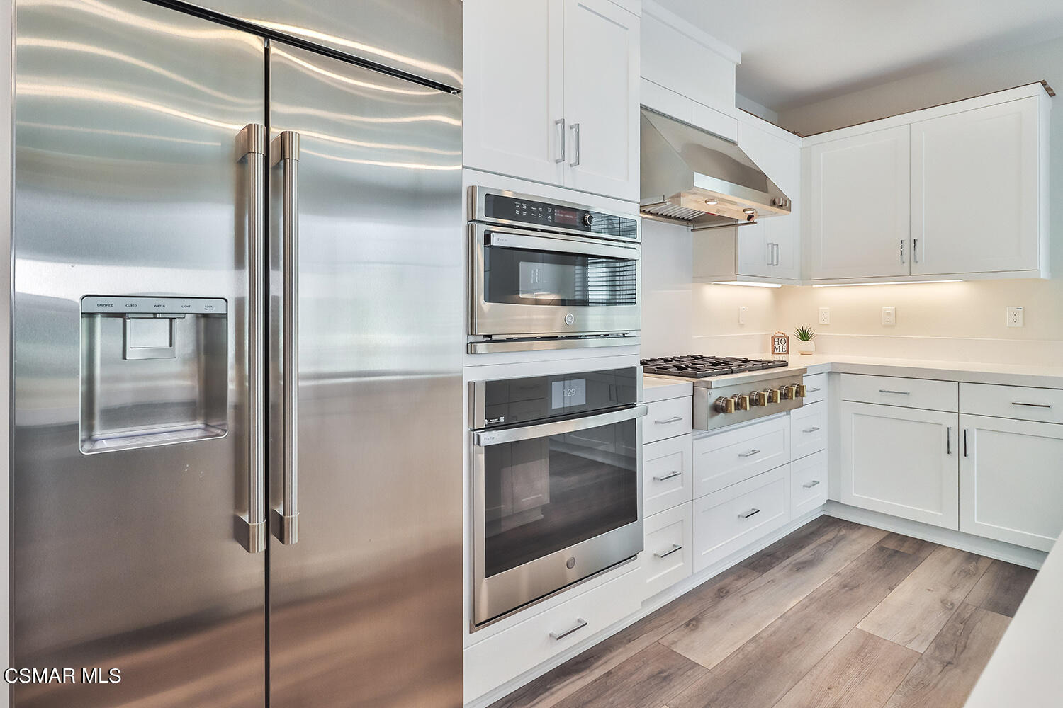 3068 Harrison Lane Simi Valley, CA 93065 - Photo 13 of 48 a kitchen with stainless steel appliances cabinets and an oven