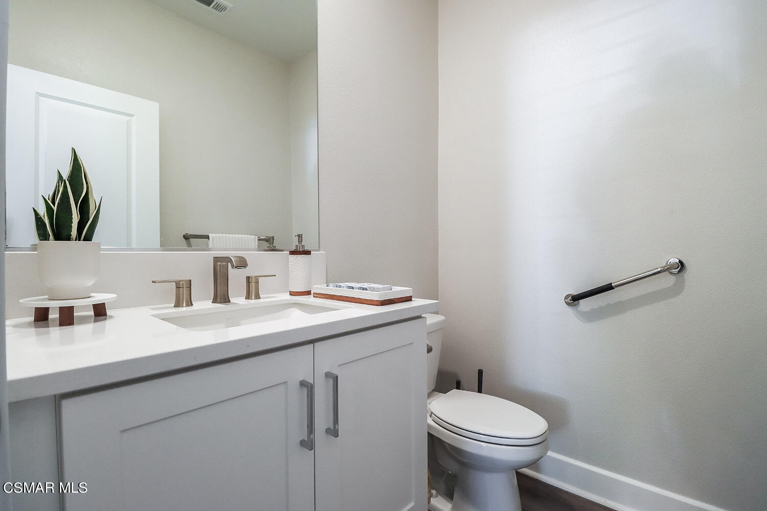 3068 Harrison Lane Simi Valley, CA 93065 - Photo 16 of 48 a bathroom with a toilet sink and mirror