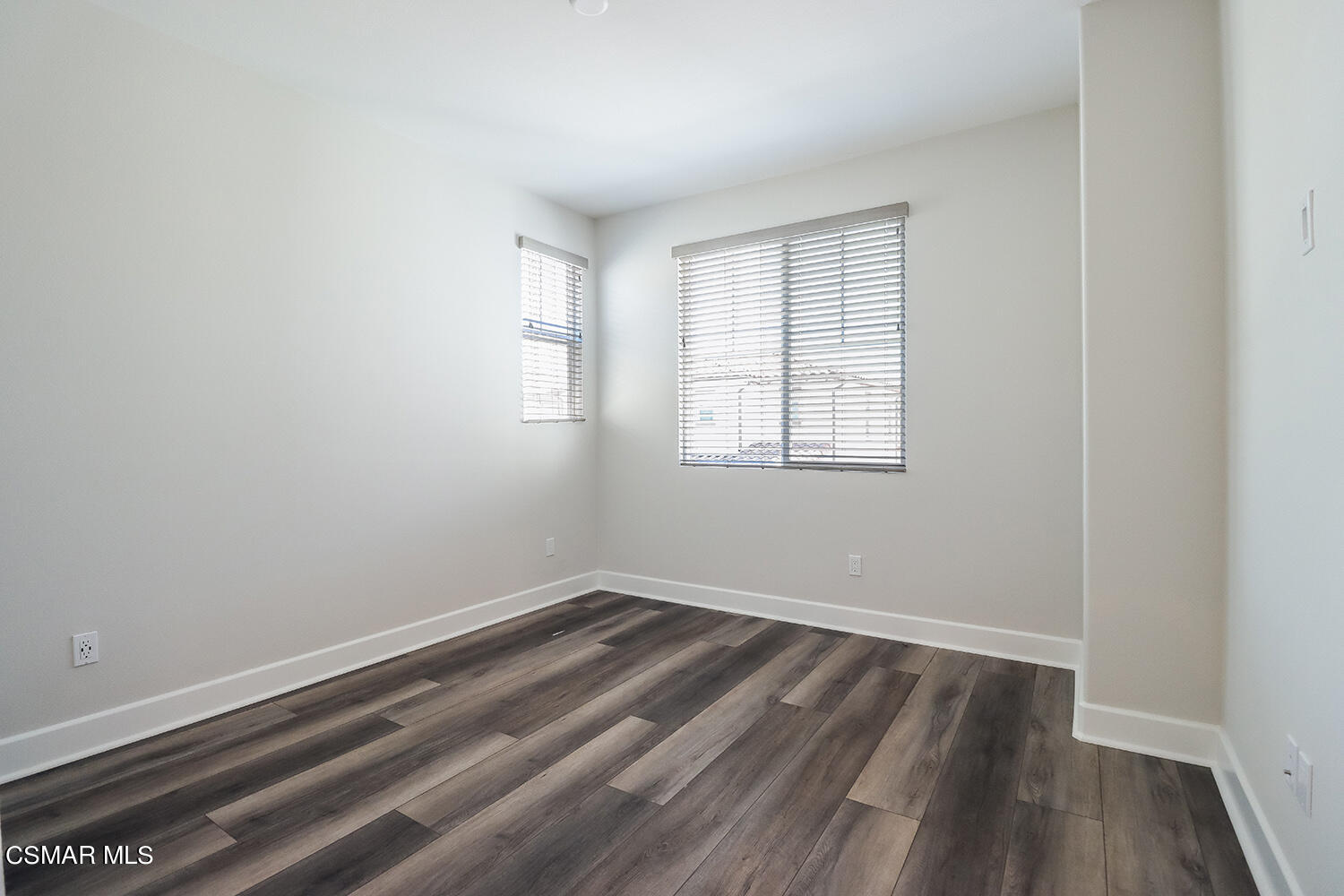 3068 Harrison Lane Simi Valley, CA 93065 - Photo 22 of 48 an empty room with wooden floor and windows