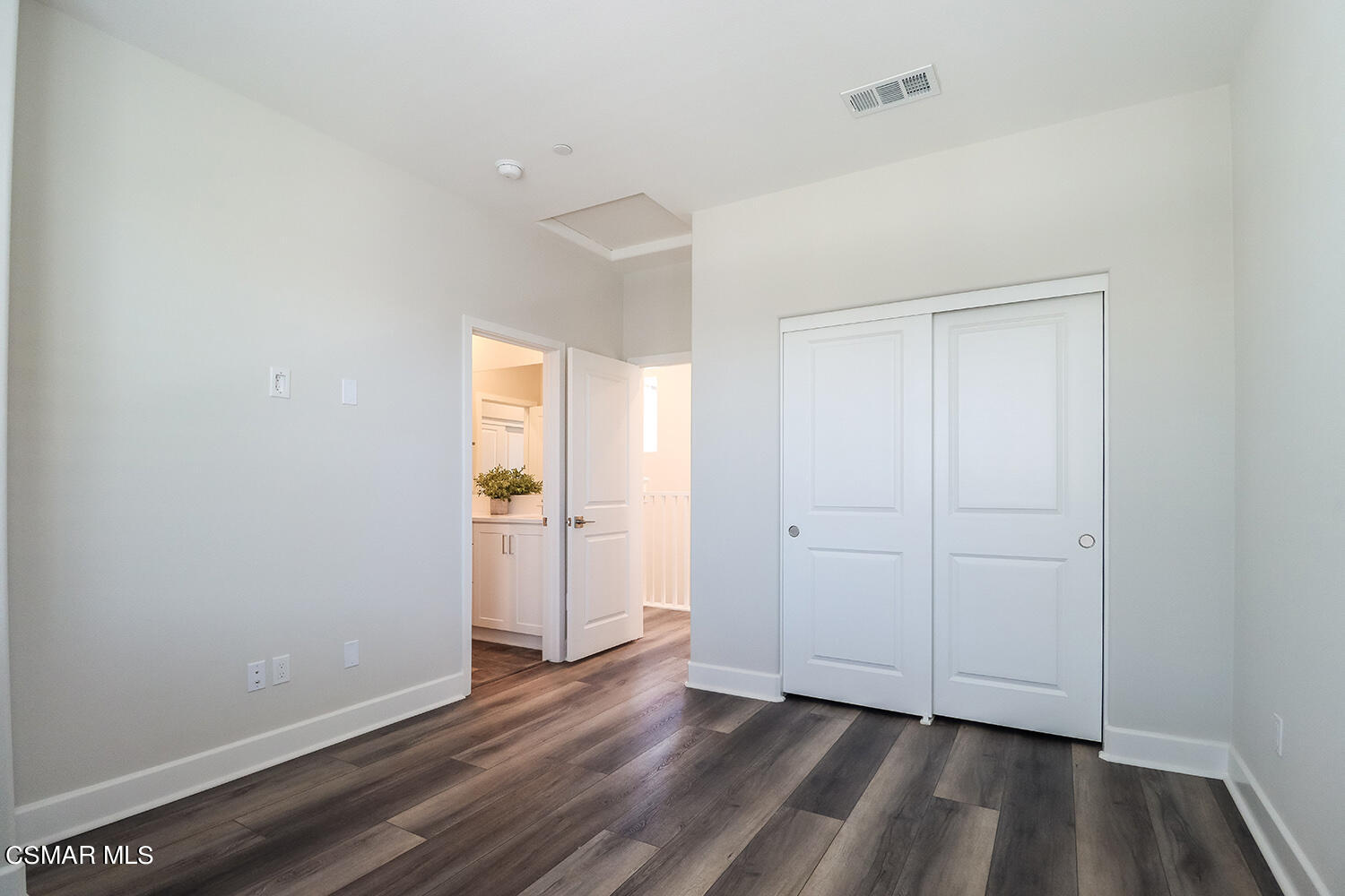 3068 Harrison Lane Simi Valley, CA 93065 - Photo 23 of 48 a view of an empty room with closet and wooden floor