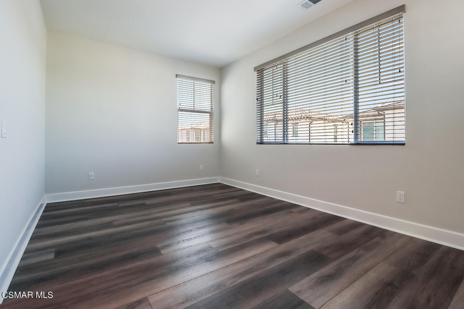 3068 Harrison Lane Simi Valley, CA 93065 - Photo 25 of 48 a view of an empty room with wooden floor and a window