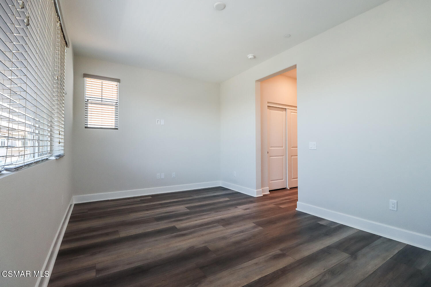 3068 Harrison Lane Simi Valley, CA 93065 - Photo 26 of 48 an empty room with wooden floor and windows