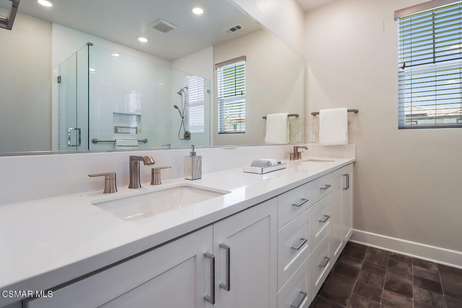 3068 Harrison Lane Simi Valley, CA 93065 - Photo 34 of 48 a bathroom with double vanity and a mirror