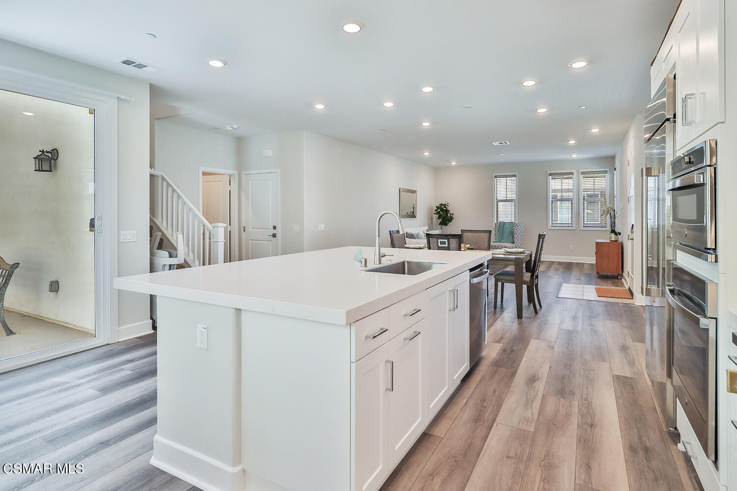 3068 Harrison Lane Simi Valley, CA 93065 - Photo 4 of 48 a kitchen with counter top space a sink appliances and cabinets