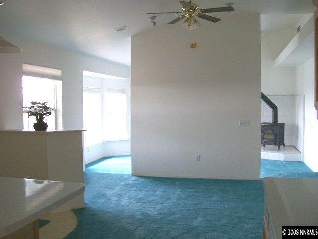 110 Alpha Butte Road Reno, NV 89508 - Photo 3 of 9 a view of livingroom with hardwood floor and a ceiling fan
