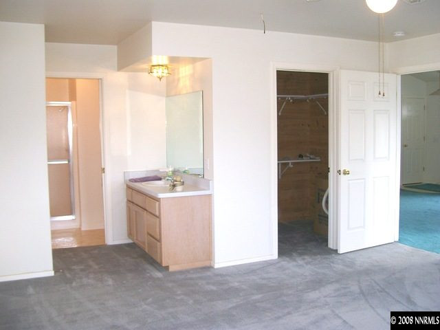 110 Alpha Butte Road Reno, NV 89508 - Photo 6 of 9 a view of kitchen with granite countertop a sink and a refrigerator