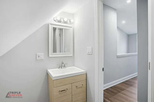 a bathroom with a sink and a mirror