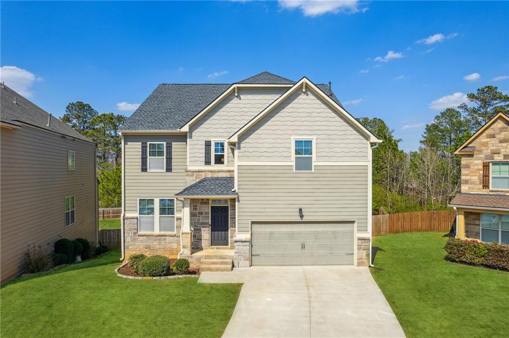 5455 Rialto Way Cumming, GA 30040 - Photo 1 of 1 a front view of a house with a yard