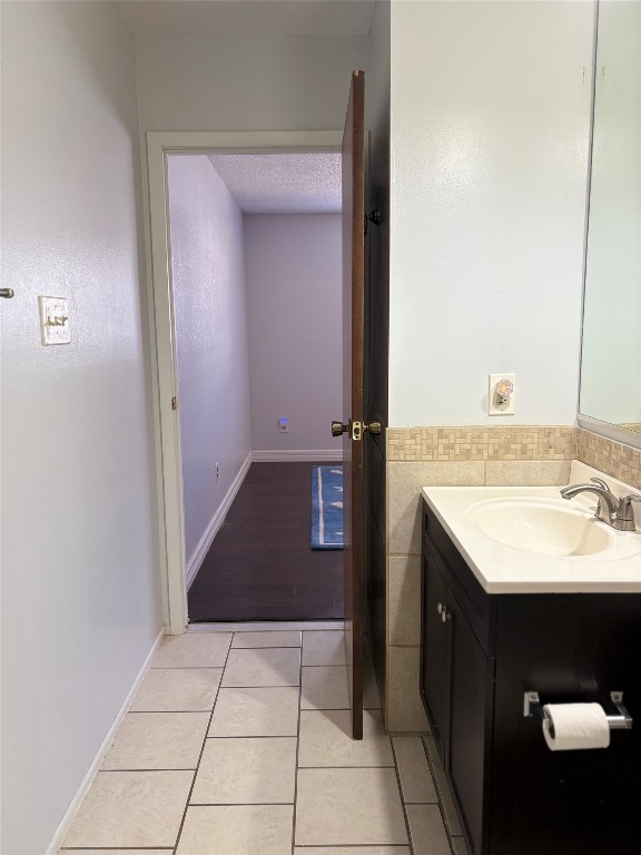 1919 American Drive, Unit A123 Leander, TX 78645 - Photo 11 of 13 a bathroom with a sink and a mirror