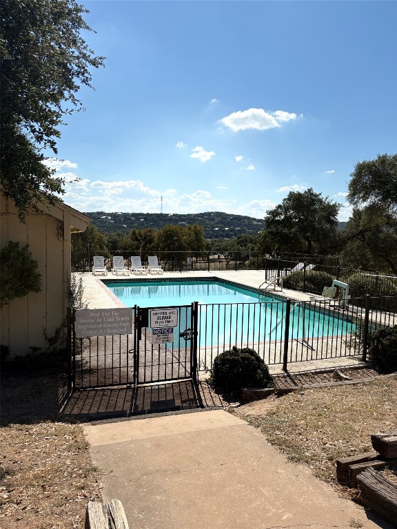 1919 American Drive, Unit A123 Leander, TX 78645 - Photo 13 of 13 a view of a roof deck with wooden fence and floor