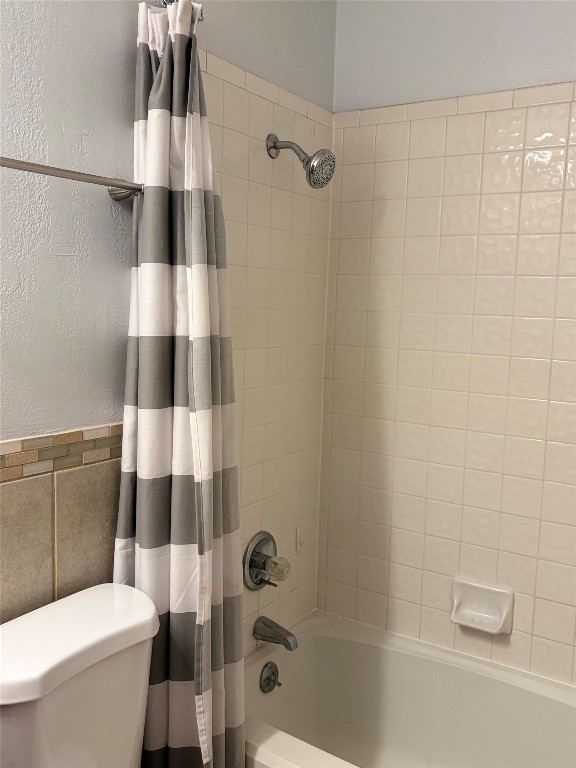 1919 American Drive, Unit A123 Leander, TX 78645 - Photo 6 of 13 a bathroom with a shower and toilet