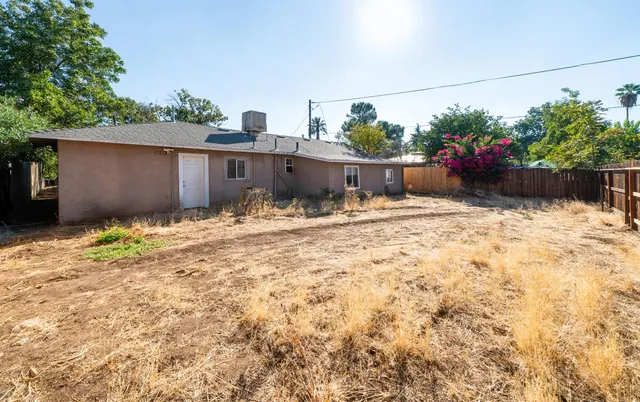 a house with trees in front of it