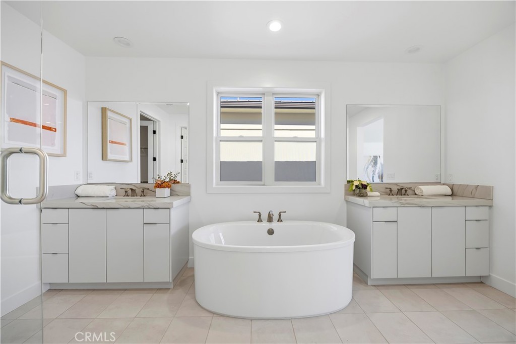 20138 Marlow Lane Porter Ranch, CA 91326 - Photo 24 of 39 a bathroom with a sink double vanity and a mirror