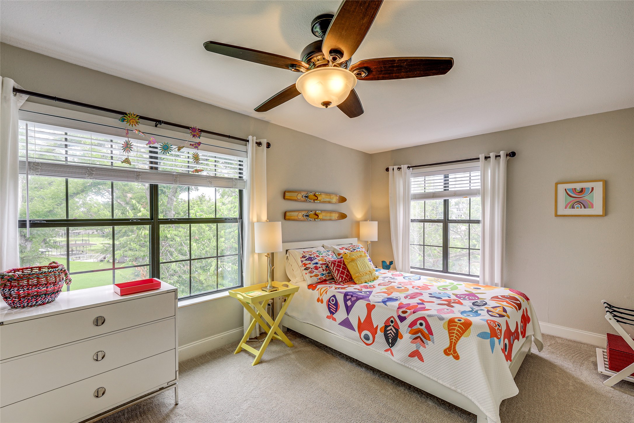 279 Waltons Way Seguin, TX 78155 - Photo 16 of 40 a bedroom with a bed and a chandelier