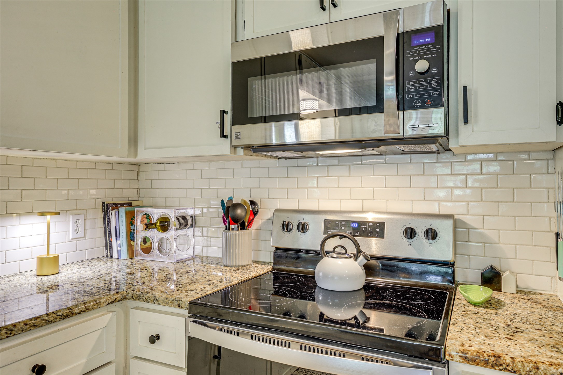 279 Waltons Way Seguin, TX 78155 - Photo 25 of 40 a kitchen with a stove and cabinets