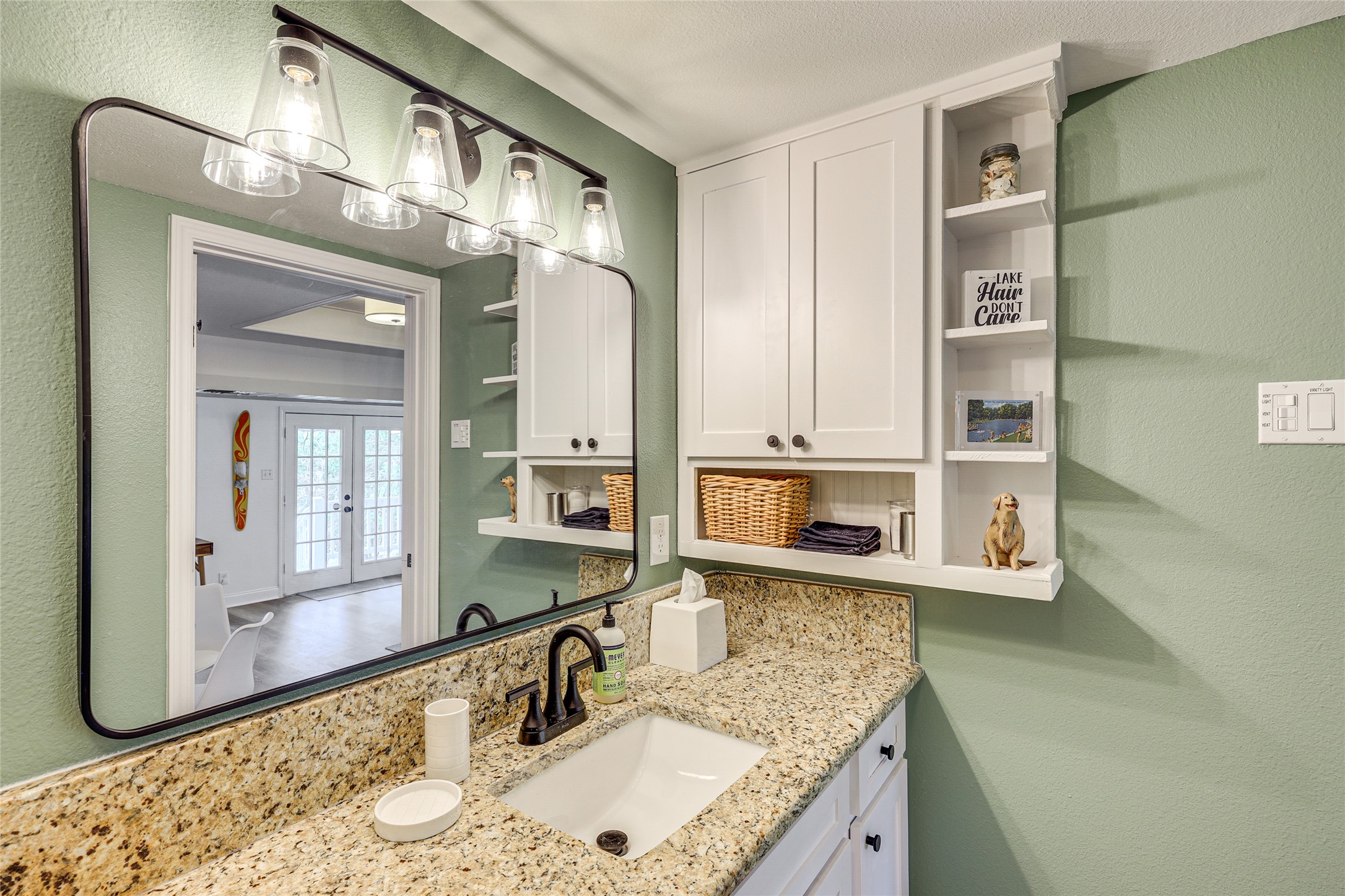 279 Waltons Way Seguin, TX 78155 - Photo 29 of 40 a kitchen with stainless steel appliances granite countertop a sink and cabinets