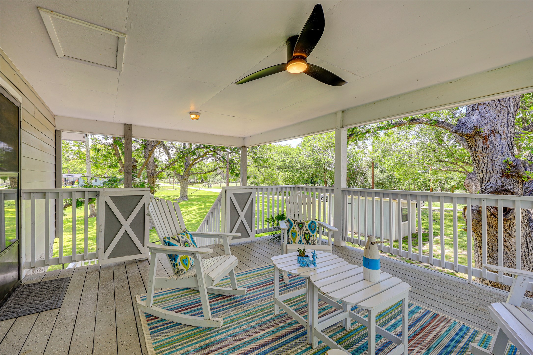 279 Waltons Way Seguin, TX 78155 - Photo 5 of 40 a view of a patio with a table chairs and a backyard