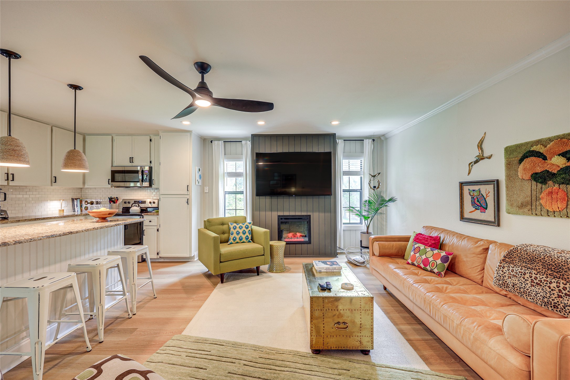 279 Waltons Way Seguin, TX 78155 - Photo 6 of 40 a living room with stainless steel appliances furniture and a flat screen tv