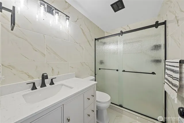 a bathroom with a bathtub and a sink