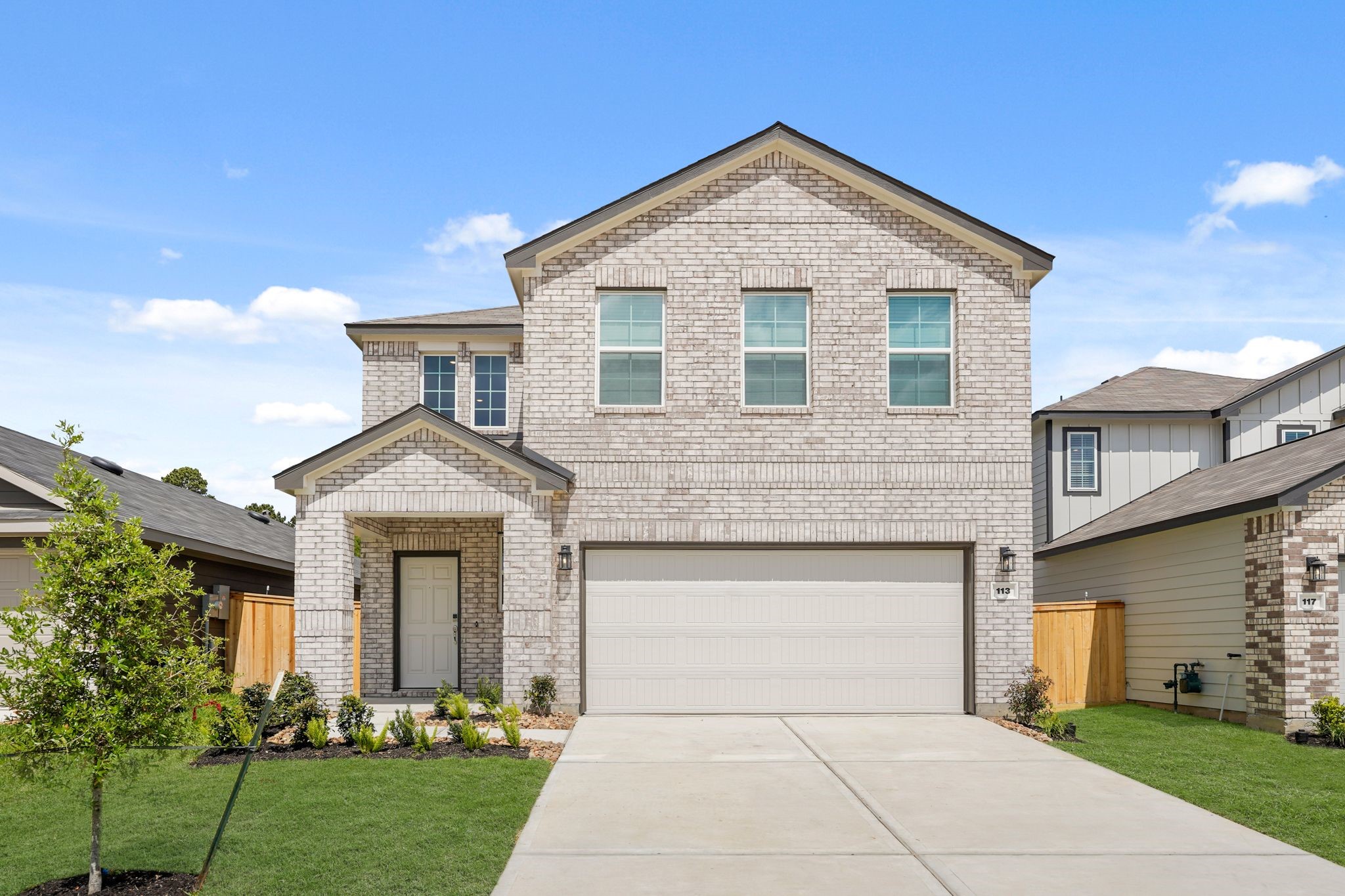 113 Rising Cedar Lane Hockley, TX 77447 - Photo 1 of 27 a front view of a house with yard
