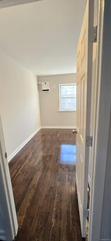 a bathroom with a sink mirror vanity and toilet