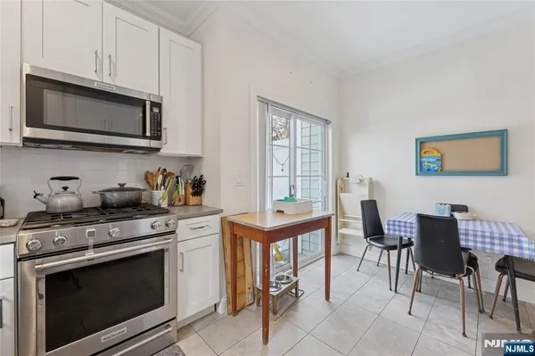 a kitchen with a stove a sink and a refrigerator