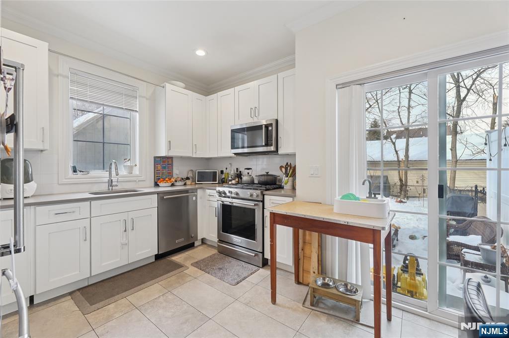 45-47 Franklin Street Tenafly, NJ 07670 - Photo 16 of 41 a kitchen with a stove a sink and a refrigerator