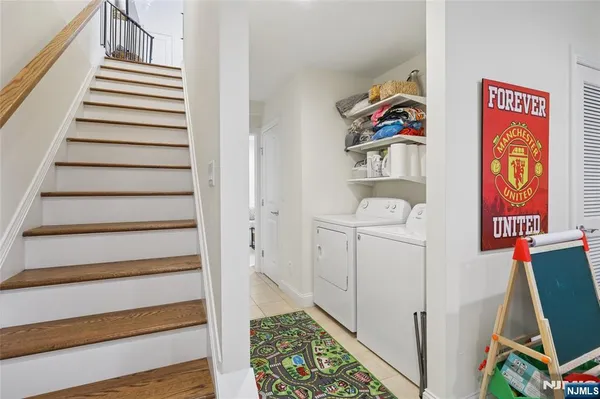 a bathroom with a granite countertop toilet and a shower