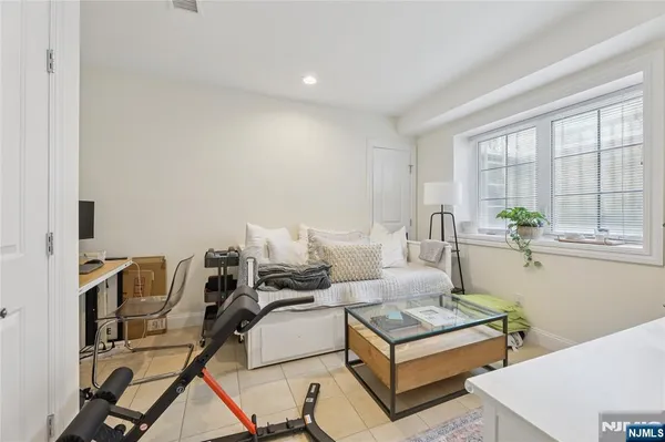 a spacious bedroom with a bed and a view of bathroom