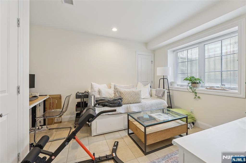 45-47 Franklin Street Tenafly, NJ 07670 - Photo 23 of 41 a living room with furniture and a table