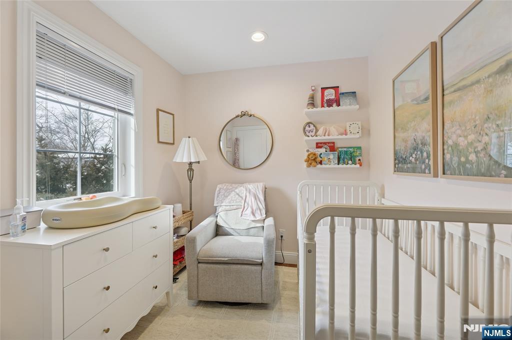 45-47 Franklin Street Tenafly, NJ 07670 - Photo 32 of 41 a living room with furniture and a window