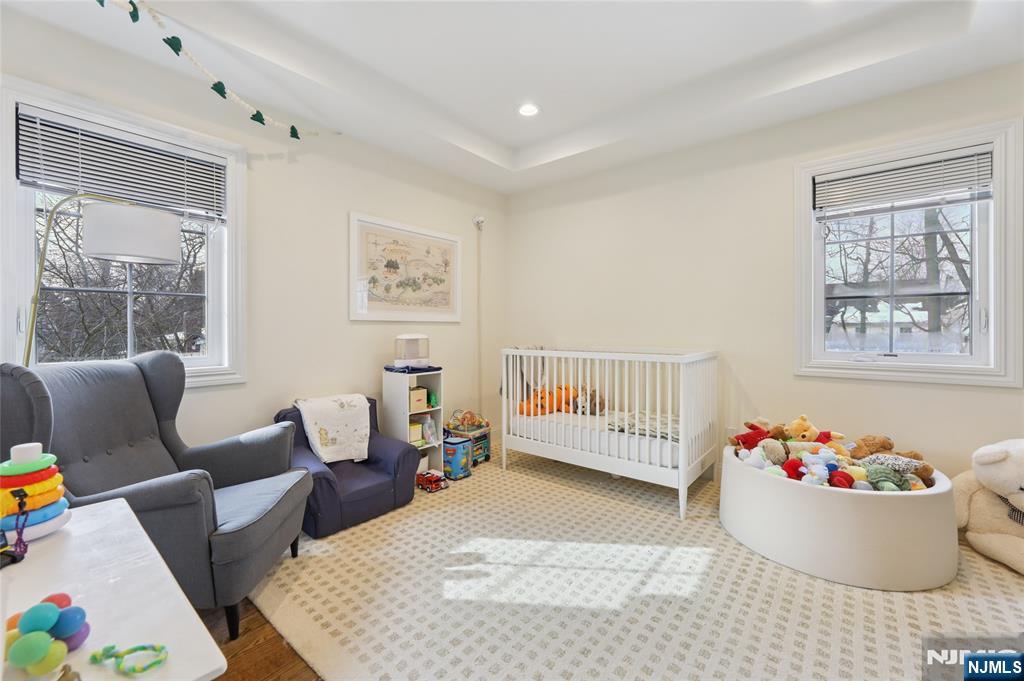 45-47 Franklin Street Tenafly, NJ 07670 - Photo 33 of 41 a living room with furniture and painting on the wall