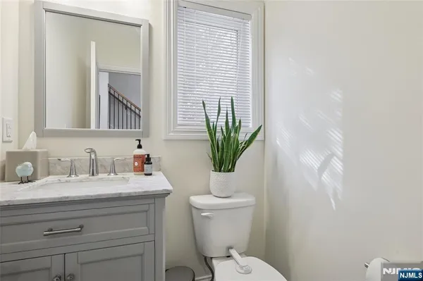 a kitchen with stainless steel appliances granite countertop a refrigerator sink and stove