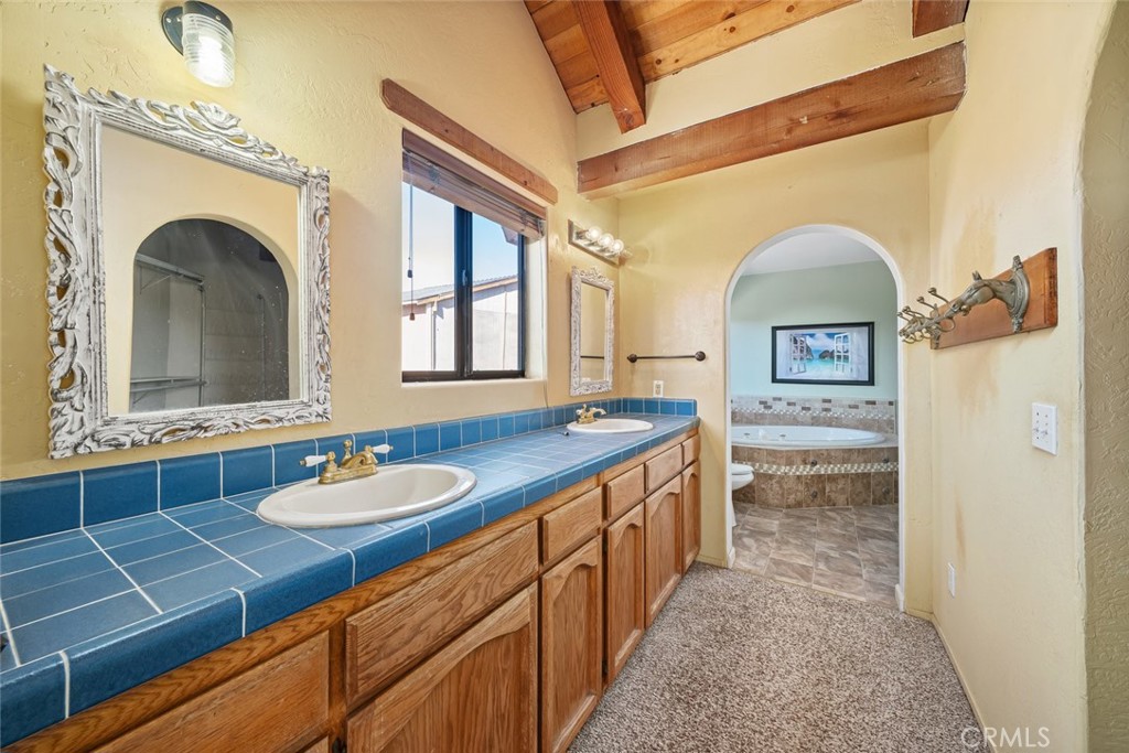330 East Ormonde Road Arroyo Grande, CA 93420 - Photo 20 of 56 a bathroom with a sink a vanity and mirror