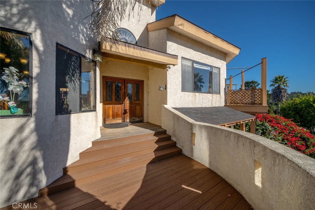 330 East Ormonde Road Arroyo Grande, CA 93420 - Photo 2 of 56 a view of a house with a large window and potted plants
