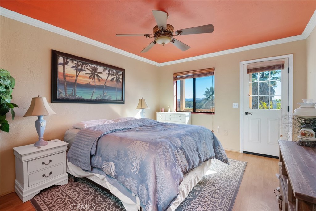 330 East Ormonde Road Arroyo Grande, CA 93420 - Photo 23 of 56 a bedroom with a bed and a chandelier