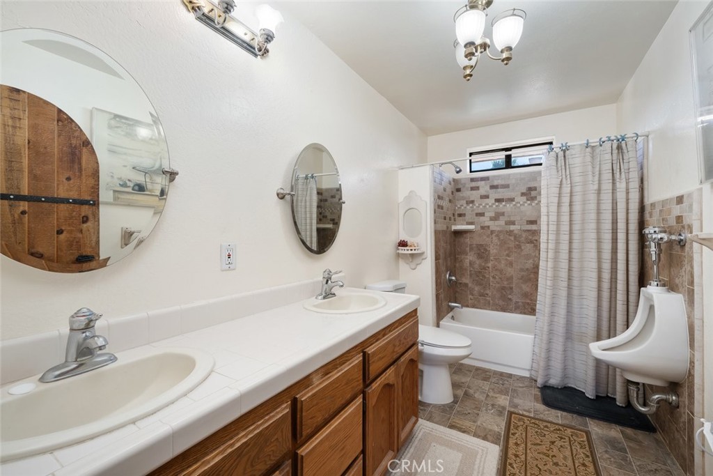 330 East Ormonde Road Arroyo Grande, CA 93420 - Photo 25 of 56 a bathroom with a double vanity sink toilet and shower
