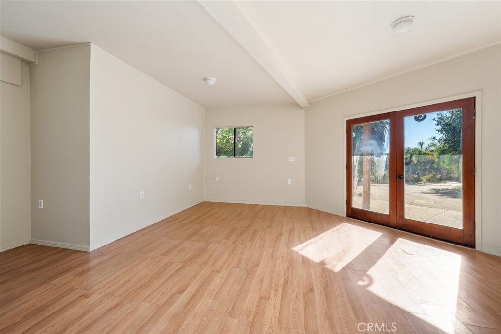 330 East Ormonde Road Arroyo Grande, CA 93420 - Photo 31 of 56 a view of an empty room with wooden floor and a window